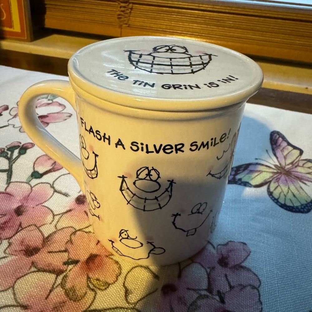 VINTAGE Hallmark Tin Grin Is In Mug with lid